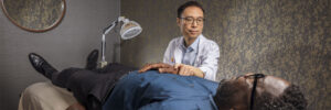 man receiving acupuncture on bed, chambers center for well-being, morristown, nj